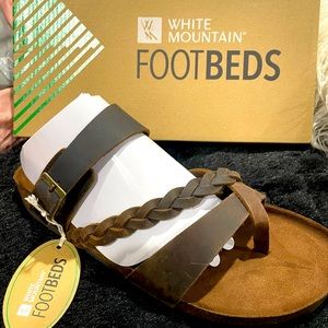Brand new brown leather white mountain sandals with adjustable strap.